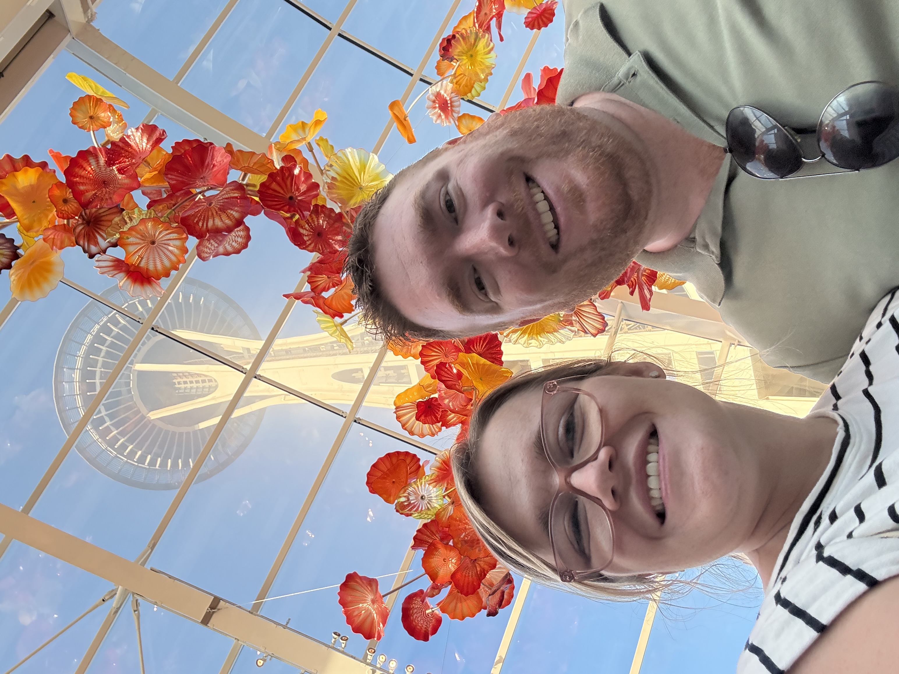 Brittany and Chris standing under the space needle 